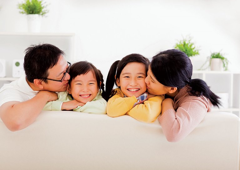 happy asian family in the living room